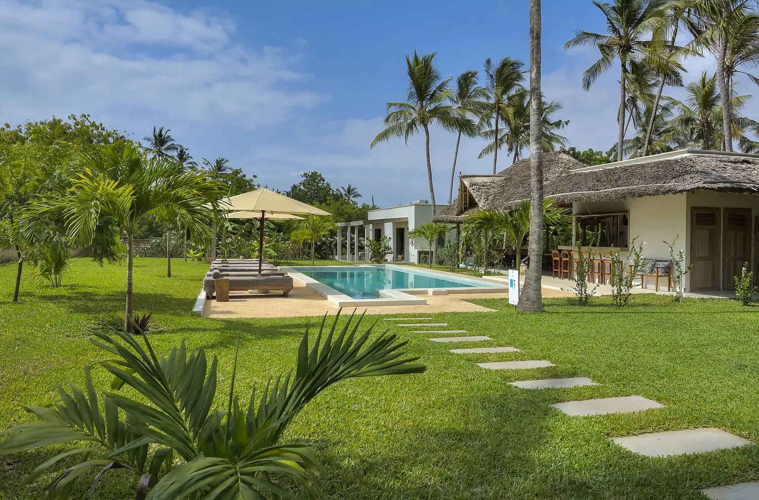 The pool and garden at Watamu Dunes by day
